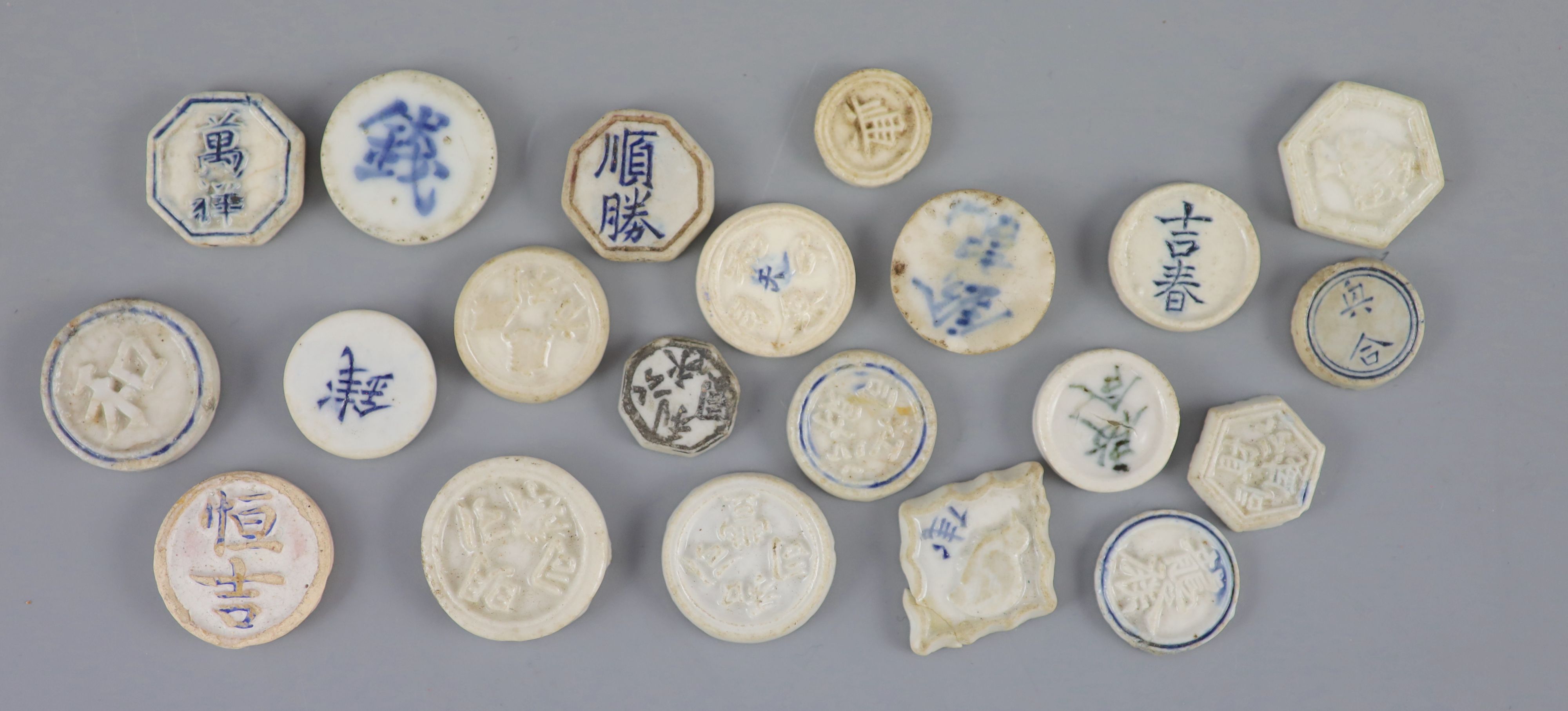 China, a group of 6 bronze coin charms or amulets, 19th century and various Thai (Siamese) porcelain gaming counters,
